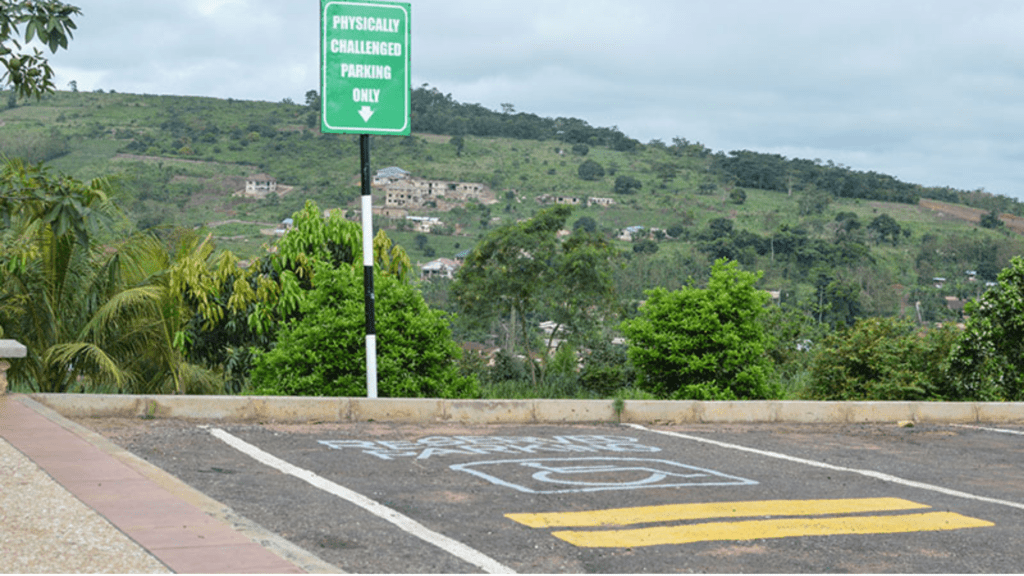 Parking lot with a sign saying parking for the physically challenged