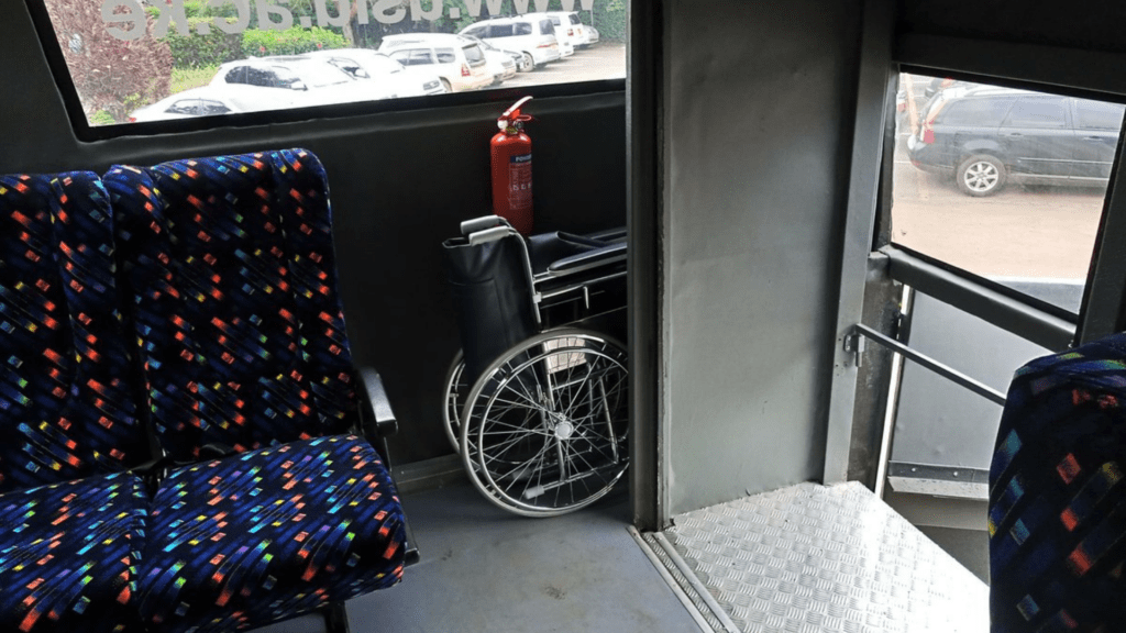 Inside of a bus showing a wheelchair