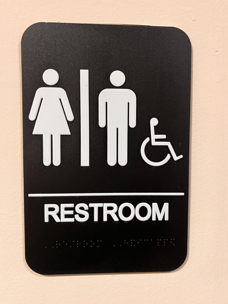 A photo of the sign for accessible toilets at Castleton University